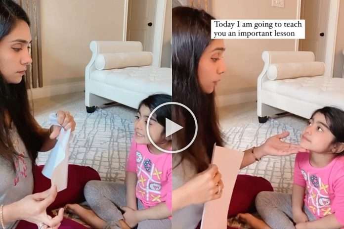 mother teaches daughter a lesson with paper