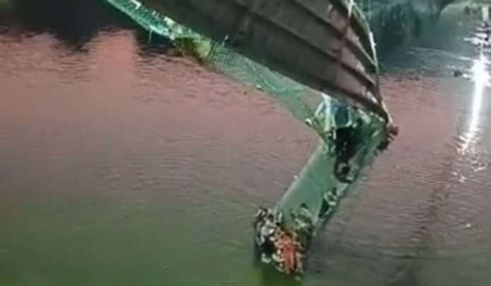 Bridge collapses into water at Morbi